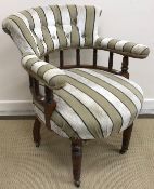 A Victorian oak framed button back elbow chair with galleried back rail and shaped seat on turned