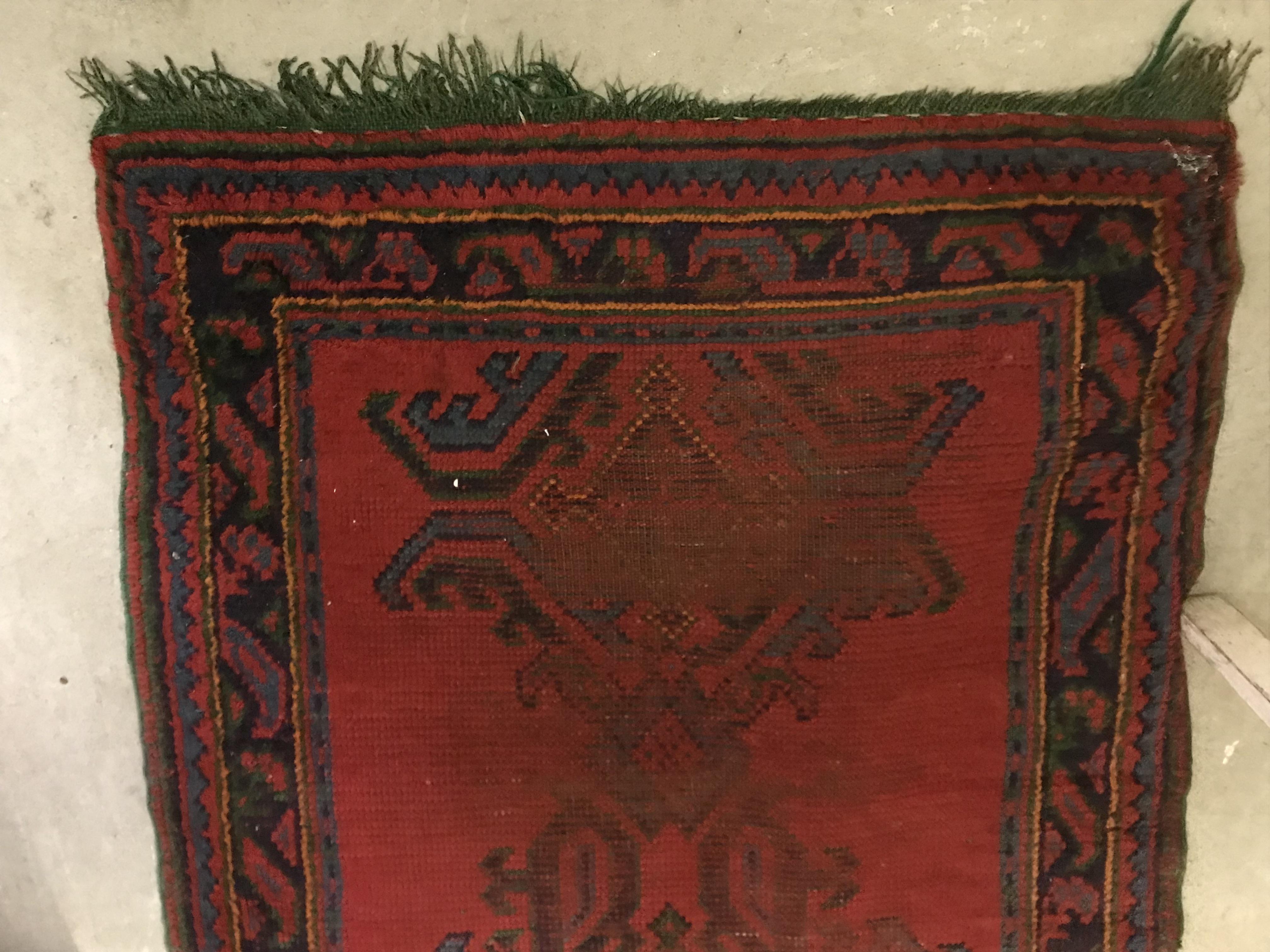A Donegal rug, the central panel set with stylised cross medallion on a red ground, - Image 24 of 26