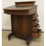 A late Victorian walnut and inlaid Davenport desk with lidded stationery compartment to the top