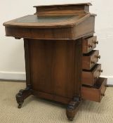 A late Victorian walnut and inlaid Davenport desk with lidded stationery compartment to the top