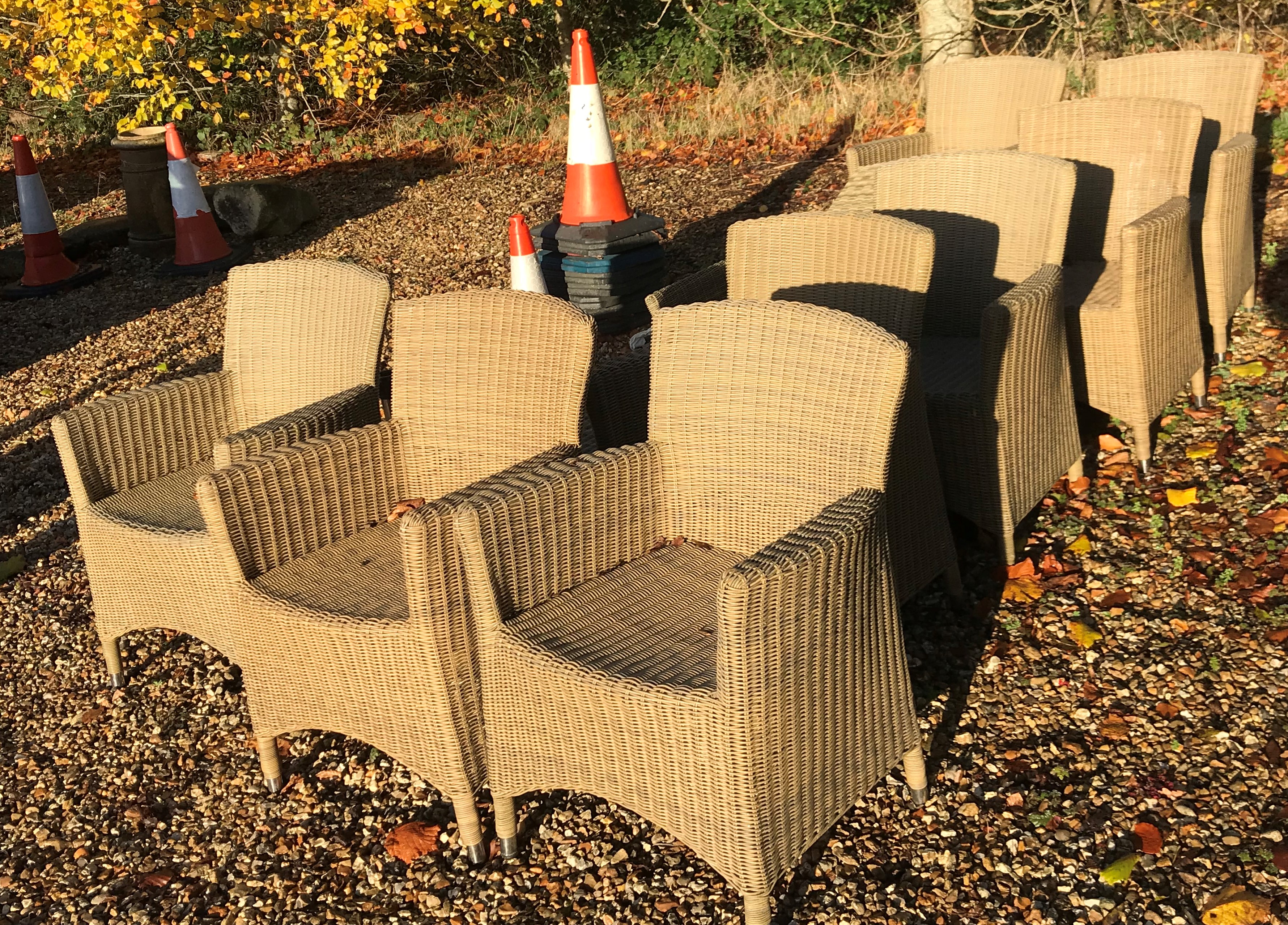 A set of eight simulated canework arm chairs (weathered) and matching lounger CONDITION