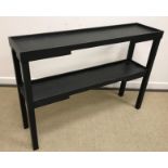 An Oka slate painted 'Kyoto' narrow console table of two tiers on square supports bearing label
