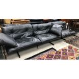 A Poltrona Frau black leather Ouverture modular sofa suite comprising three two seat modules and an