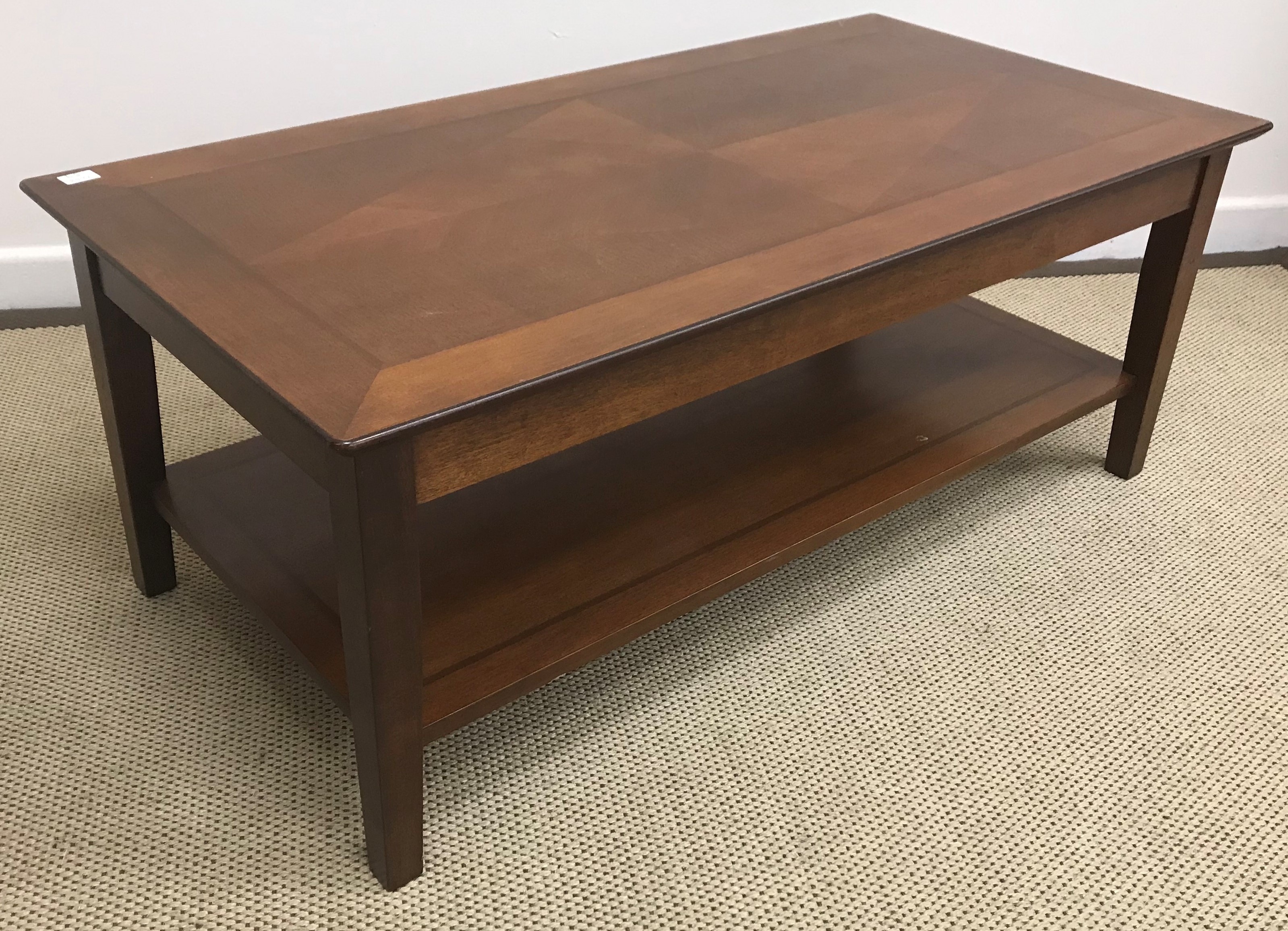 A burr walnut veneered kidney shaped dressing table with central drawer flanked by two banks of two