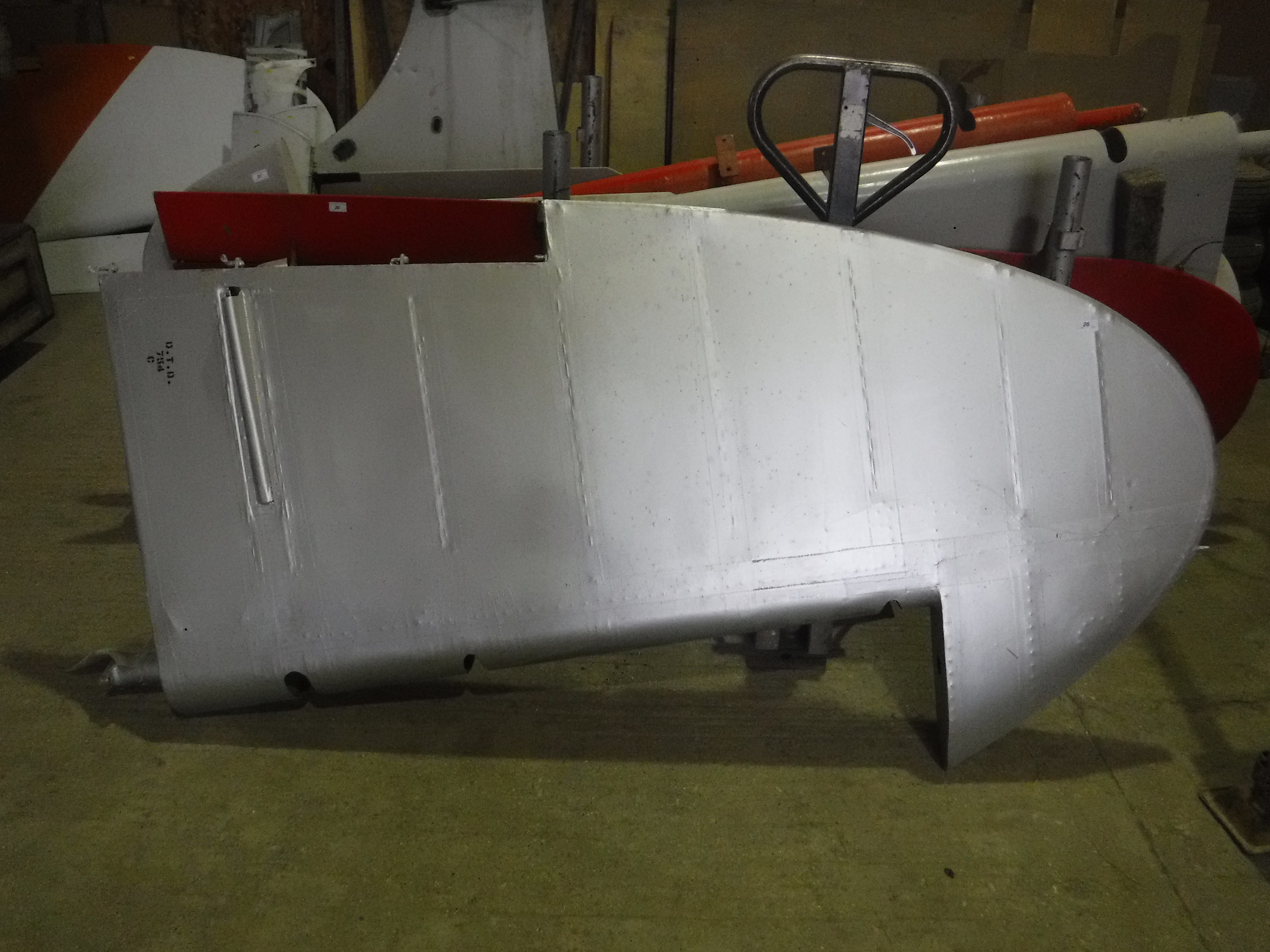A De Havilland tail fin, silver painted, approx 220 cm high, bearing Dove label inscribed "Type No.