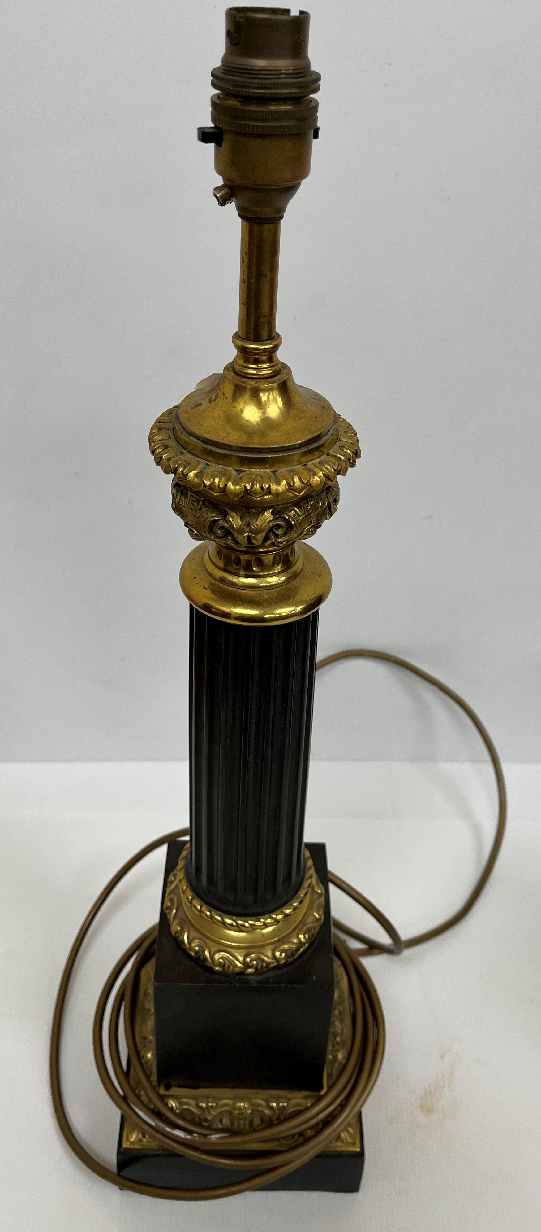 A 19th Century chocolate patinated bronze and gilt brass banded oil lamp base of fluted goblet form, - Image 3 of 3