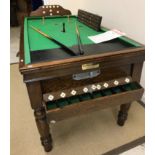 An oak framed bar billiards table with green baize top,