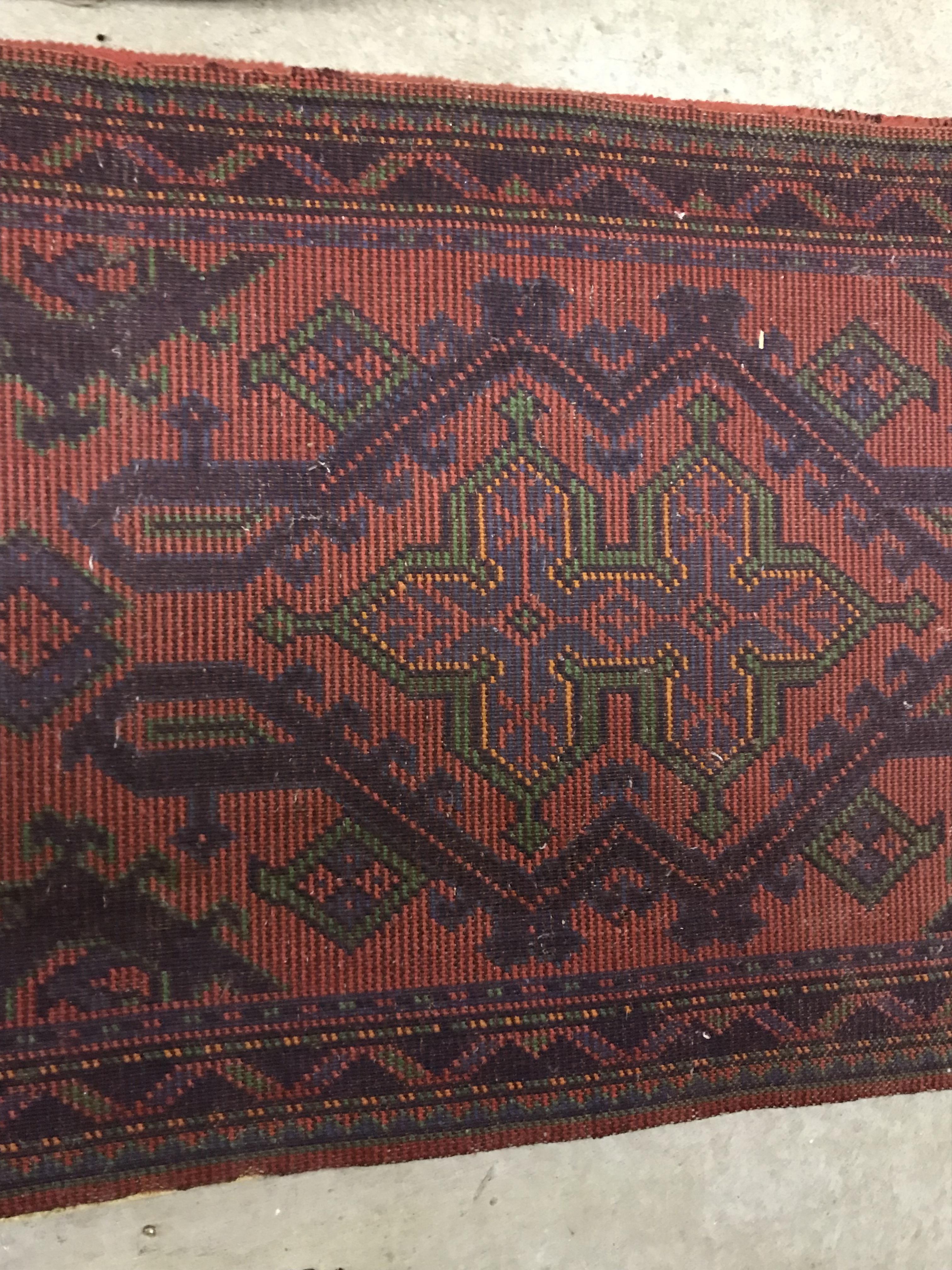 A Donegal rug, the central panel set with stylised cross medallion on a red ground, - Image 11 of 26