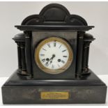 A circa 1900 black marble cased architectural mantle clock with column decoration and eight day