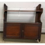 An Edwardian mahogany fire guard, with three glass panels, the centre panel sliding up,