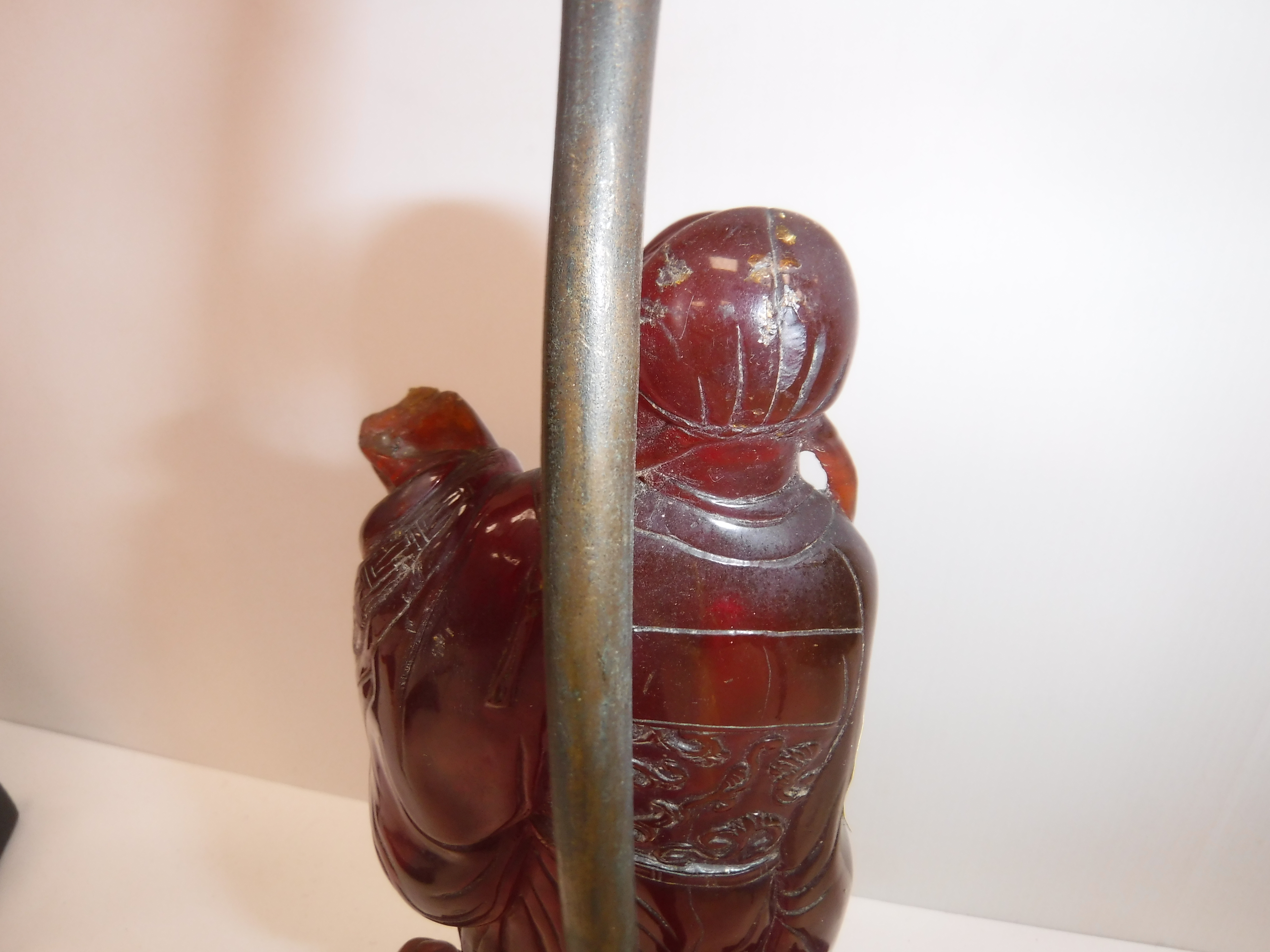 A pair of Chinese carved amber figures of a man and a woman in robes, - Image 8 of 27