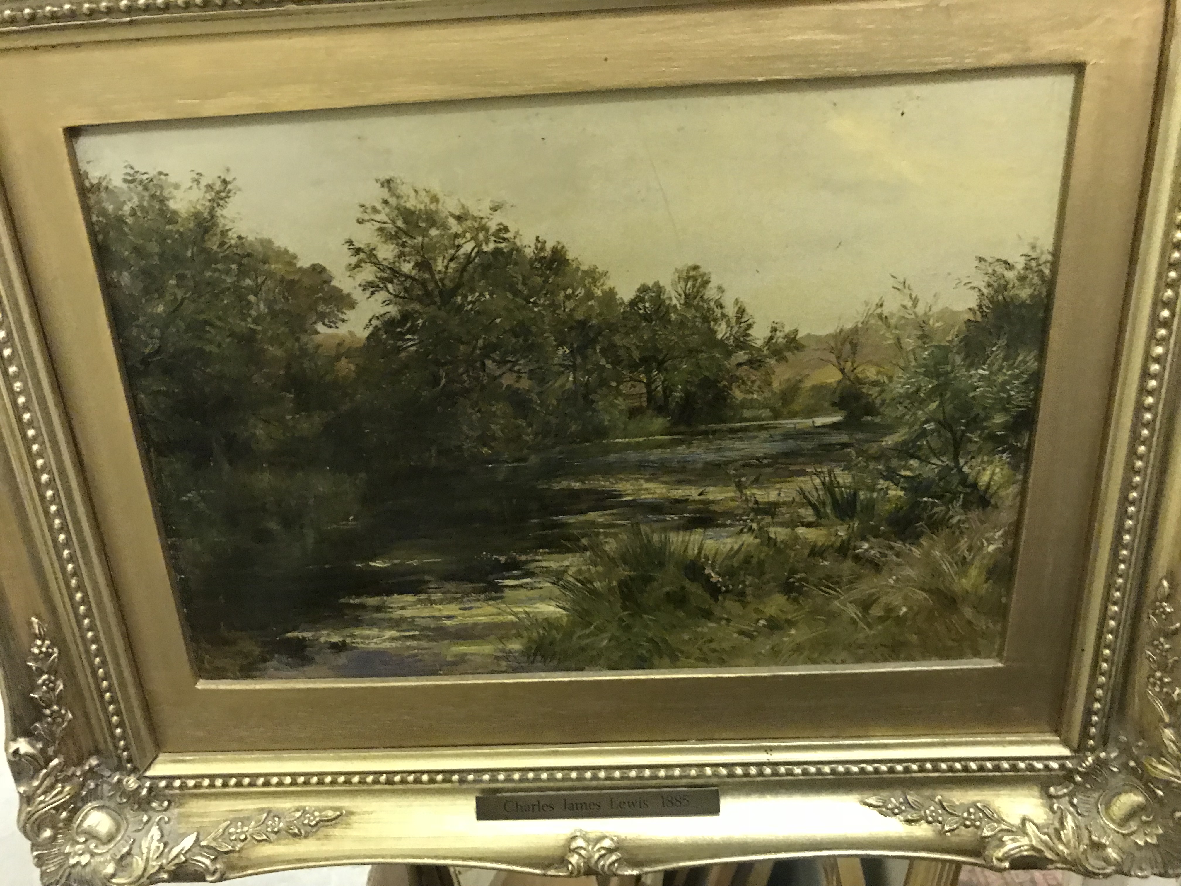 CHARLES JAMES LEWIS "Tree lined river scene" oil on canvas,