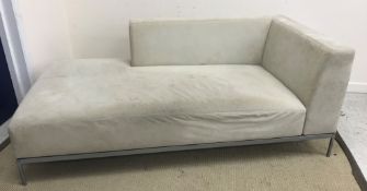 A Ligne Roset grey suede effect corner sofa on grey painted tubular framed base,