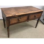 A 19th Century pine two drawer side table, on turned legs,