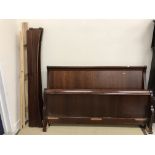 A modern mahogany lit en bateau in the 19th Century French manner (possibly And So To Bed),
