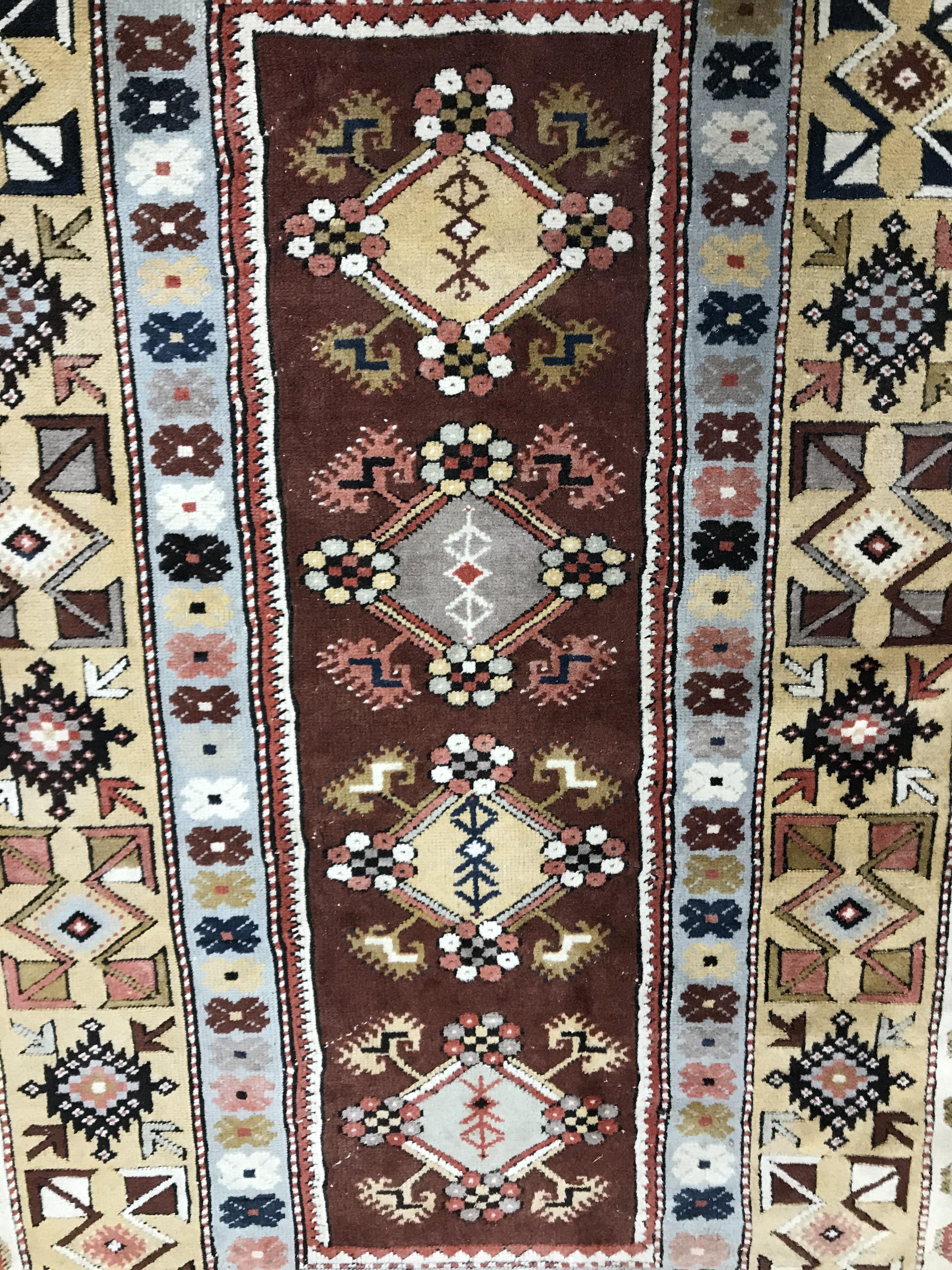 A Caucasian rug, the central panel set with five repeating medallions on a salmon pink ground, - Image 3 of 13