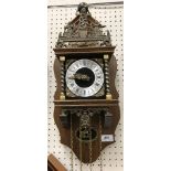 A collection of six various Dutch or Dutch style wall clocks and a brass faced German wall clock by