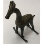 A 19th Century Indian bronze horse figure with decorative bodywork on a sleigh style base 14 cm