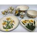 A collection of Griselda Hill Pottery Wemyss ware daffodil pattern including six egg cups,