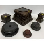 A box of various stands including bronze pedestals,