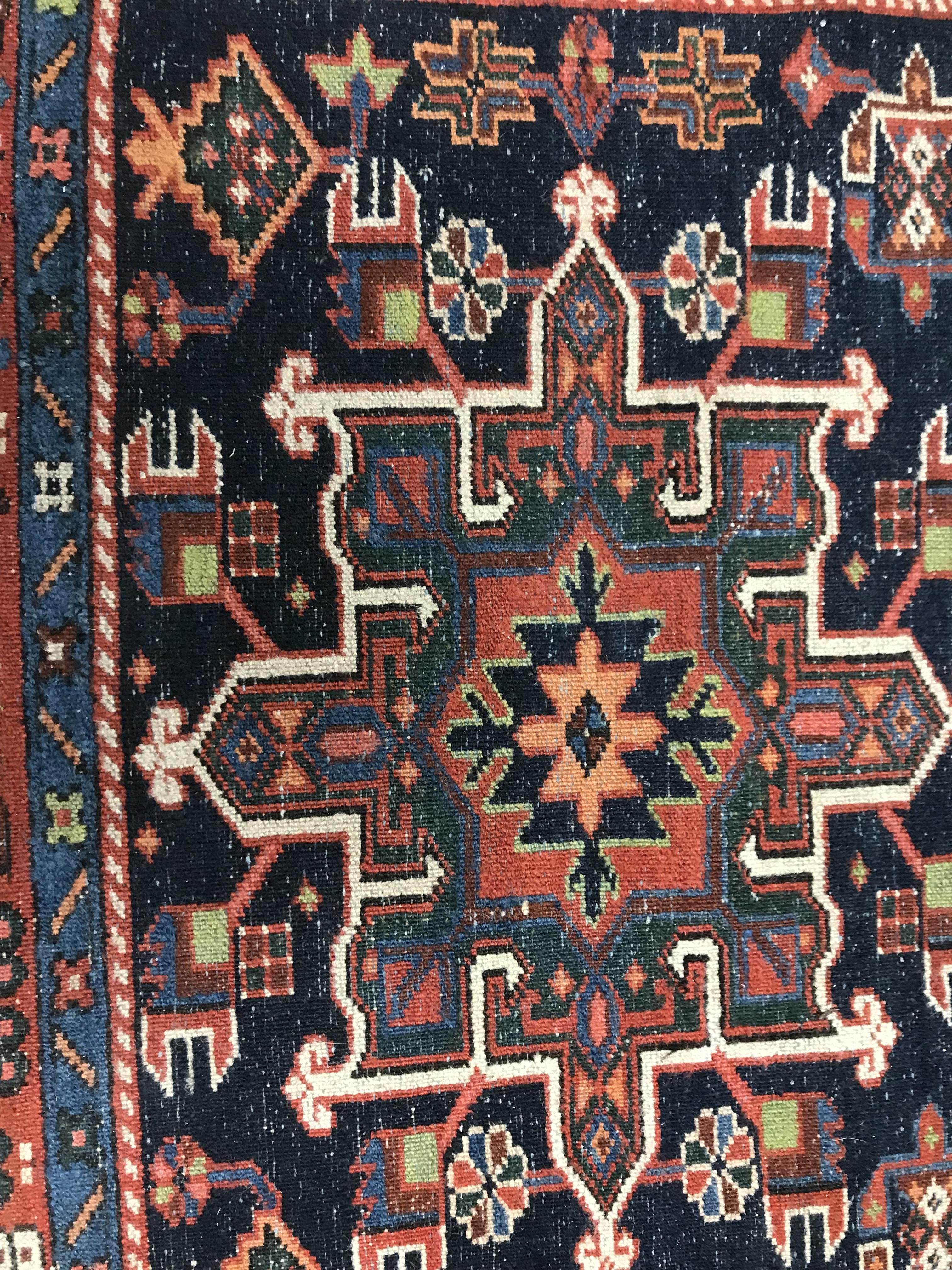 A Persian rug, the central panel set with three medallions on a dark blue ground, - Image 7 of 7