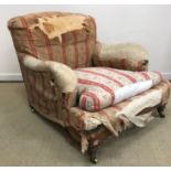 A Victorian upholstered armchair by Howard & Sons of Berners Street London,