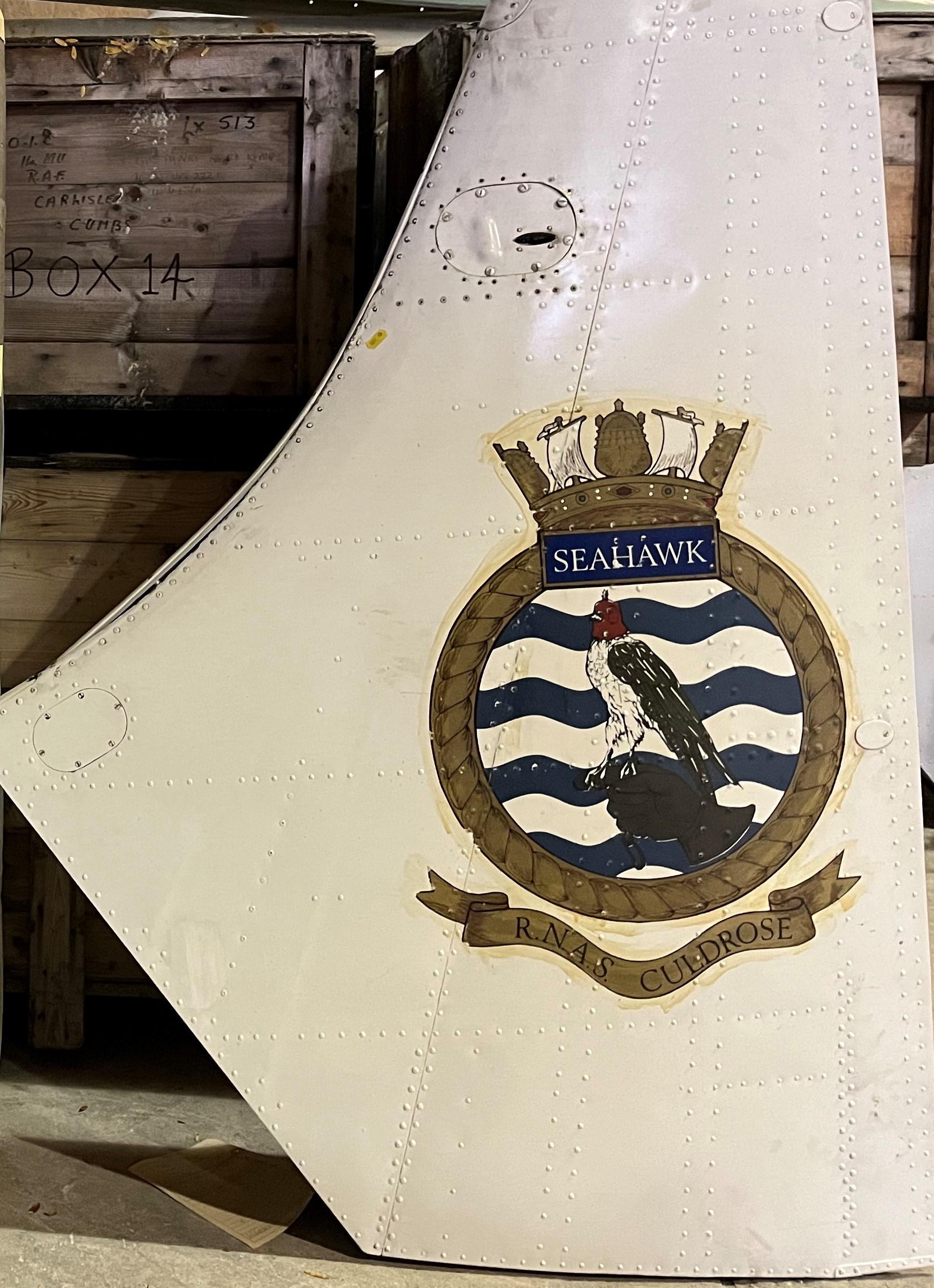 An RNAS Culdrose Sea Hawk tail fin section with transfer decorated hawk motif,
