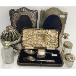 A collection of silver and plated items to include two silver mounted photo frames,