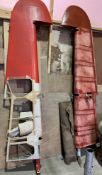 Two De Havilland tail fin elevators, red painted, approx 290 cm long,