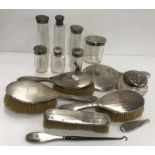 A collection of silver mounted dressing table bottles,
