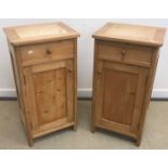 A pair of Victorian pine pot cupboards, the plain tops above a drawer and cupboard door, 41.