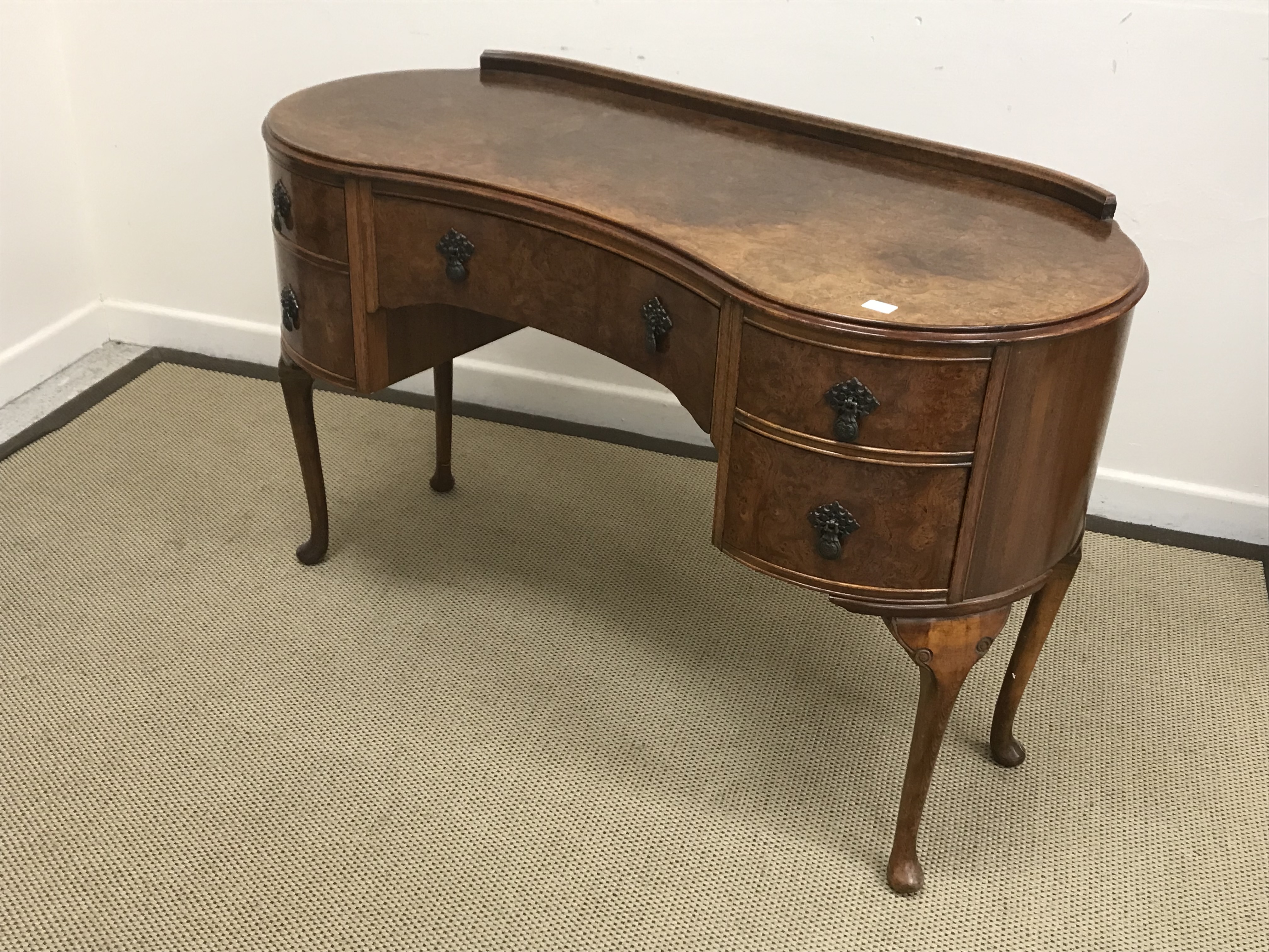 A burr walnut veneered kidney shaped dressing table with central drawer flanked by two banks of two - Image 2 of 3