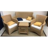 A Lloyd Loom style three piece conservatory suite of two seat sofa,