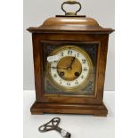 A circa 1900 walnut cased French mantle clock,