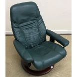An Ekornes stressless green leather upholstered armchair,
