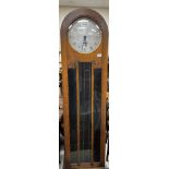 A 1930s oak cased long case clock with dome top,