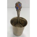 A Danish hammered silver christening cup/beaker with flared rim on a beaded foot,