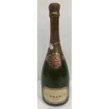 One bottle Krug Grande Cuvée Champagne, white or pale yellow label,