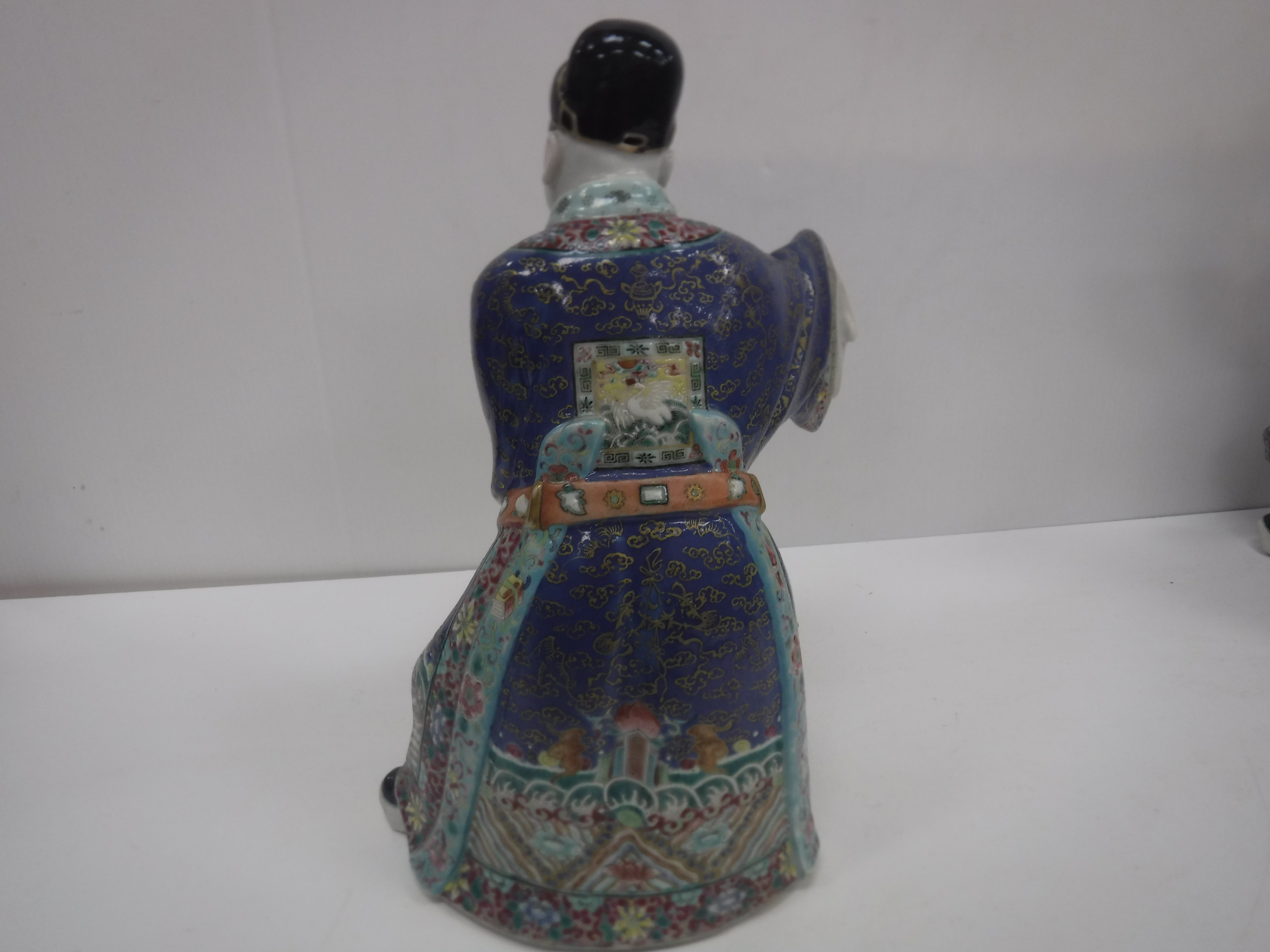 A set of three 19th Century Chinese polychrome decorated figures, one seated, one bearing sword, - Image 32 of 37