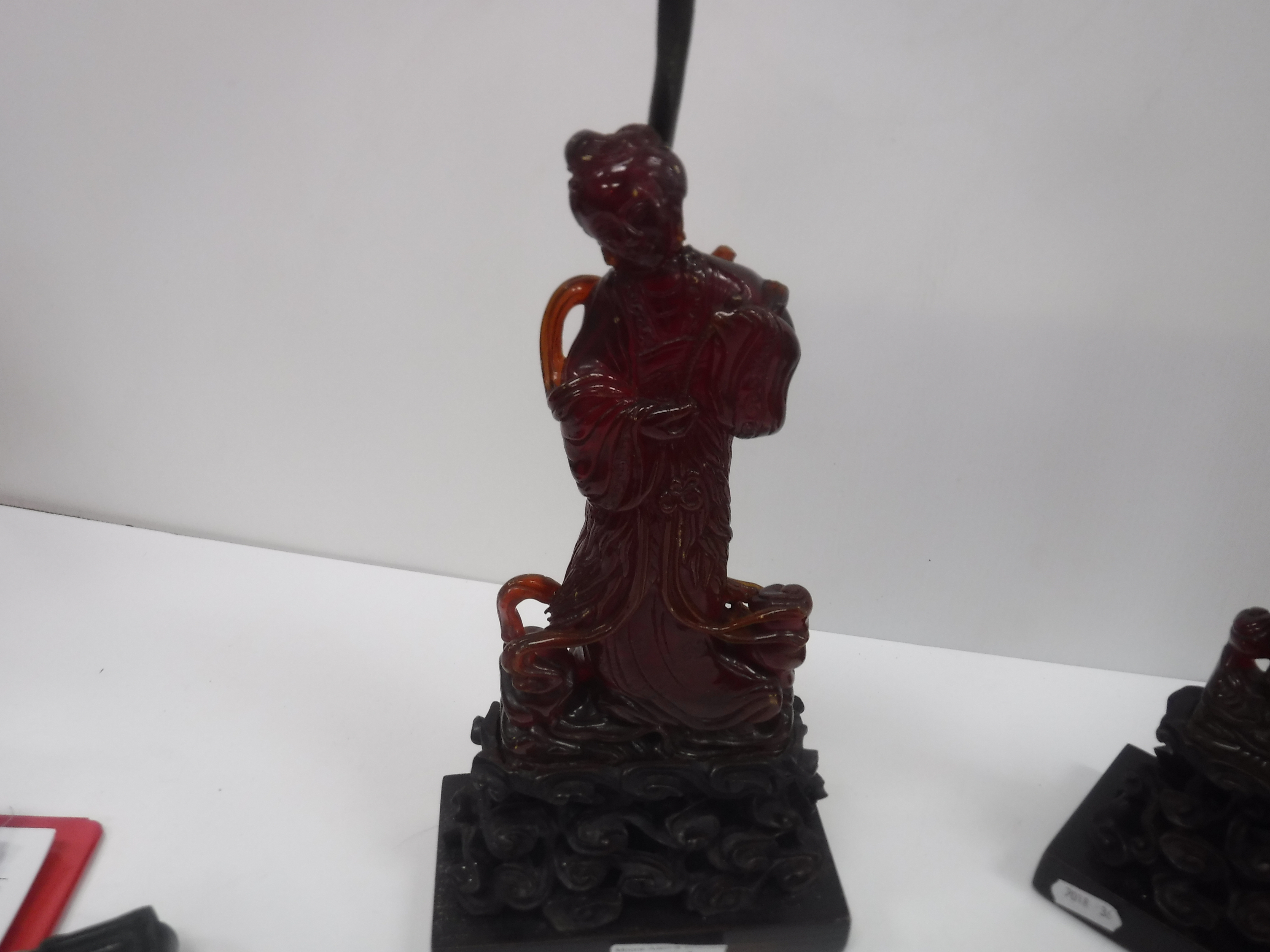 A pair of Chinese carved amber figures of a man and a woman in robes, - Image 16 of 27