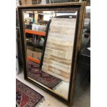 A modern mottled gilded framed rectangular wall mirror with bevel edged plate,