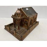 A circa 1900 matchstick type build wooden chapel with dome decorated porch way and walled border 25