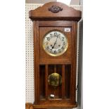 A 1930s French walnut cased wall clock with two air musical movement with octagonal dial and Arabic