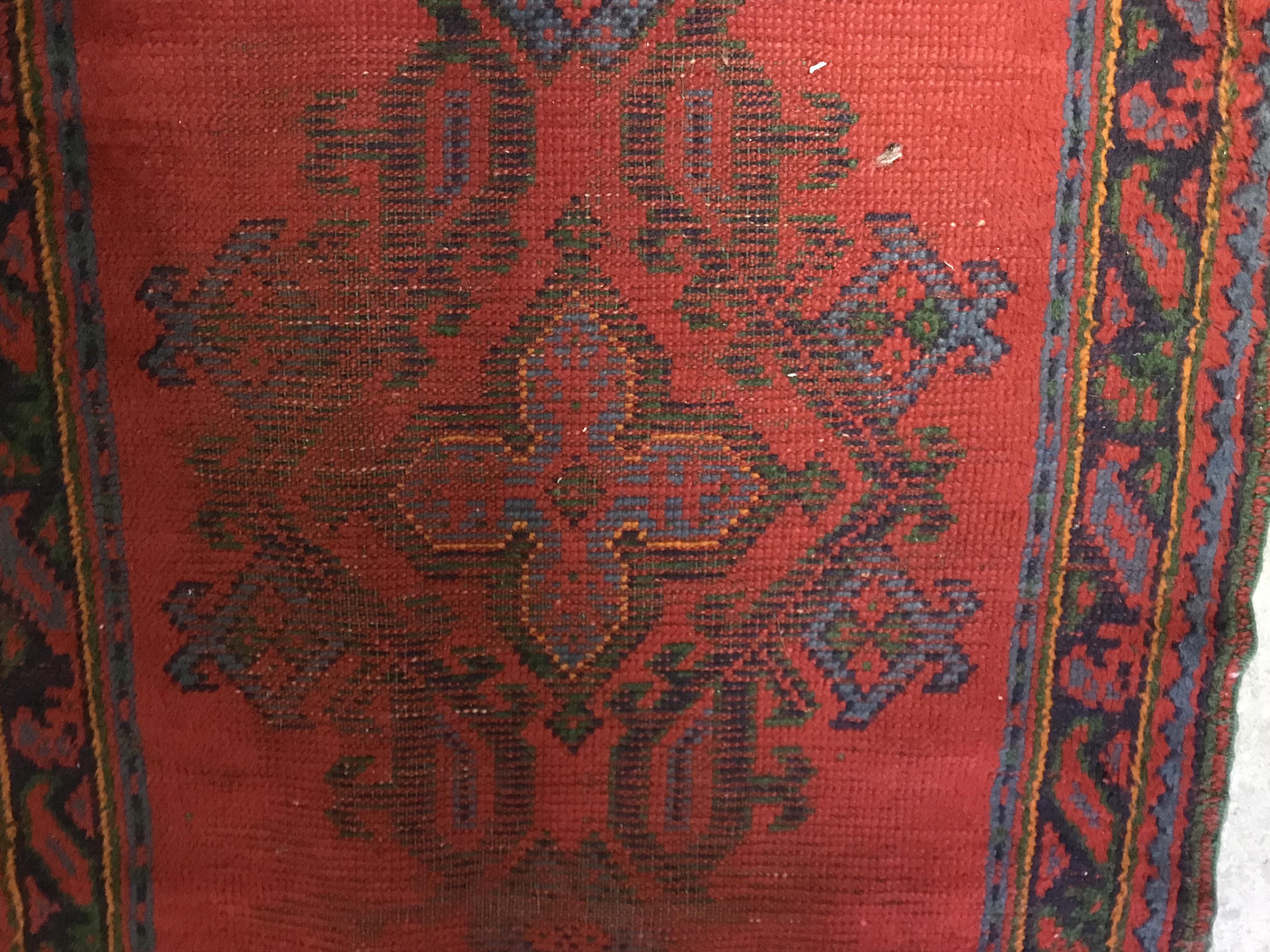 A Donegal rug, the central panel set with stylised cross medallion on a red ground, - Image 23 of 26