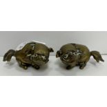 Two 19th Century Chinese bronze dog of Fo figures with hollow bases, possibly brush holders,