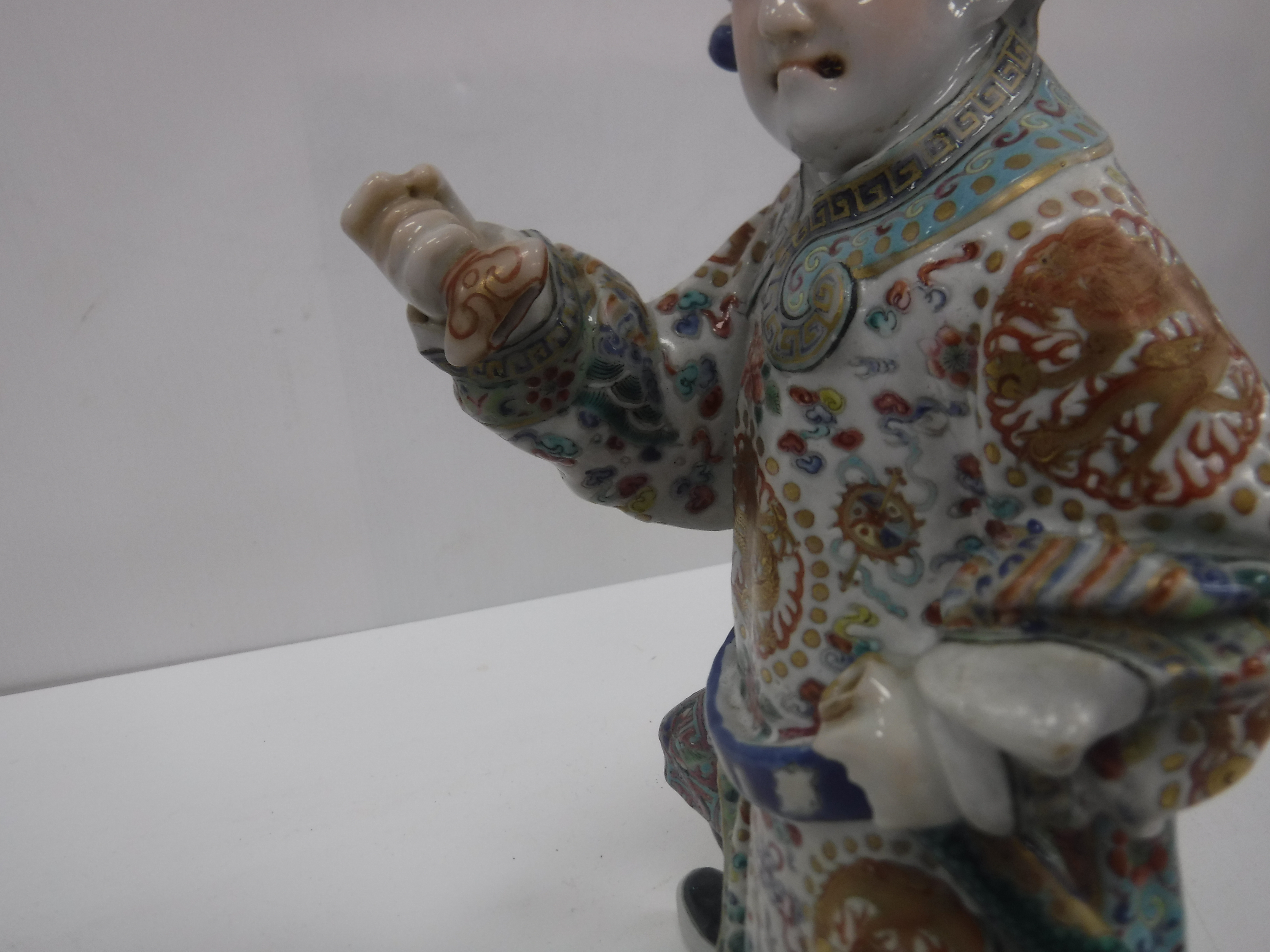 A set of three 19th Century Chinese polychrome decorated figures, one seated, one bearing sword, - Image 17 of 37