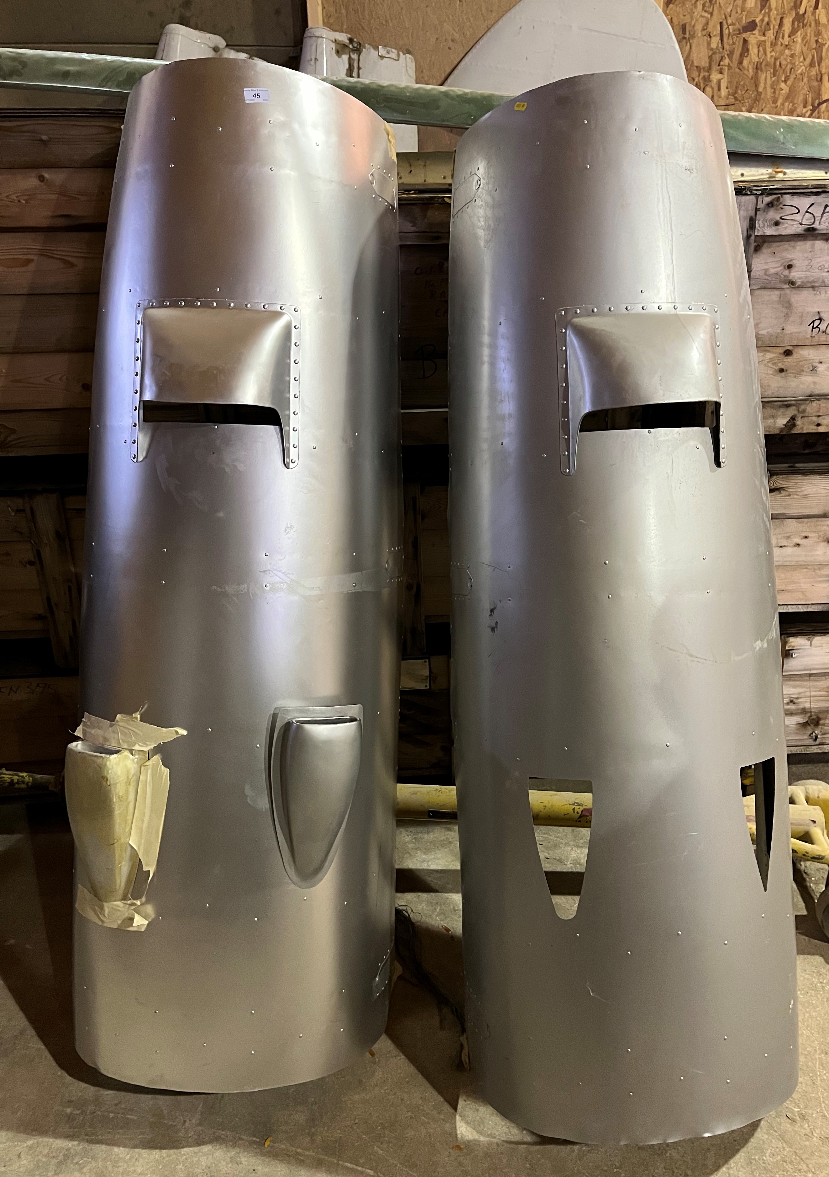 Two painted aluminium engine covers, believed to be De Havilland Devon Type,