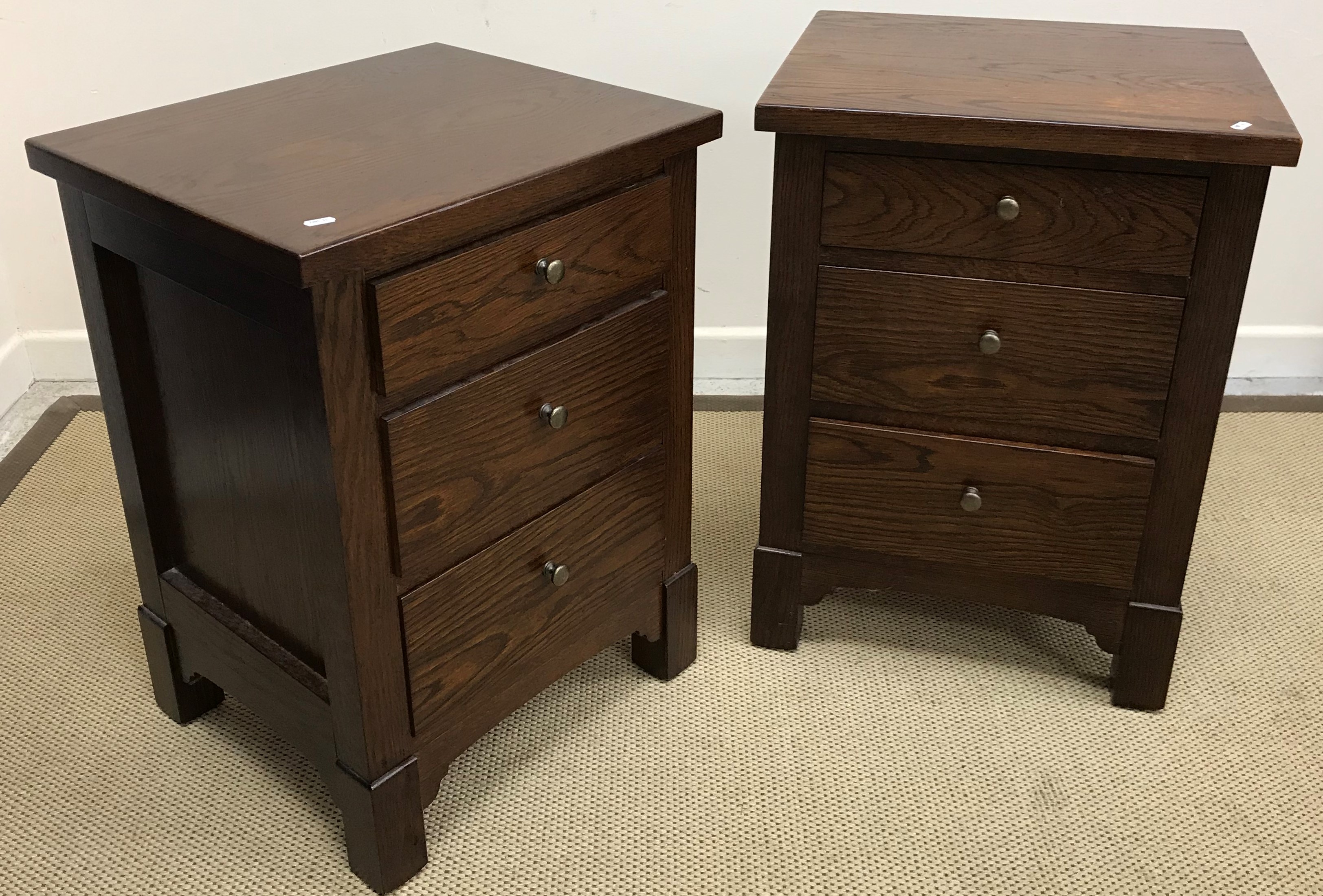 A pair of modern oak three drawer bedside chests (ex Cranfields Wellington New Zealand - retailers),