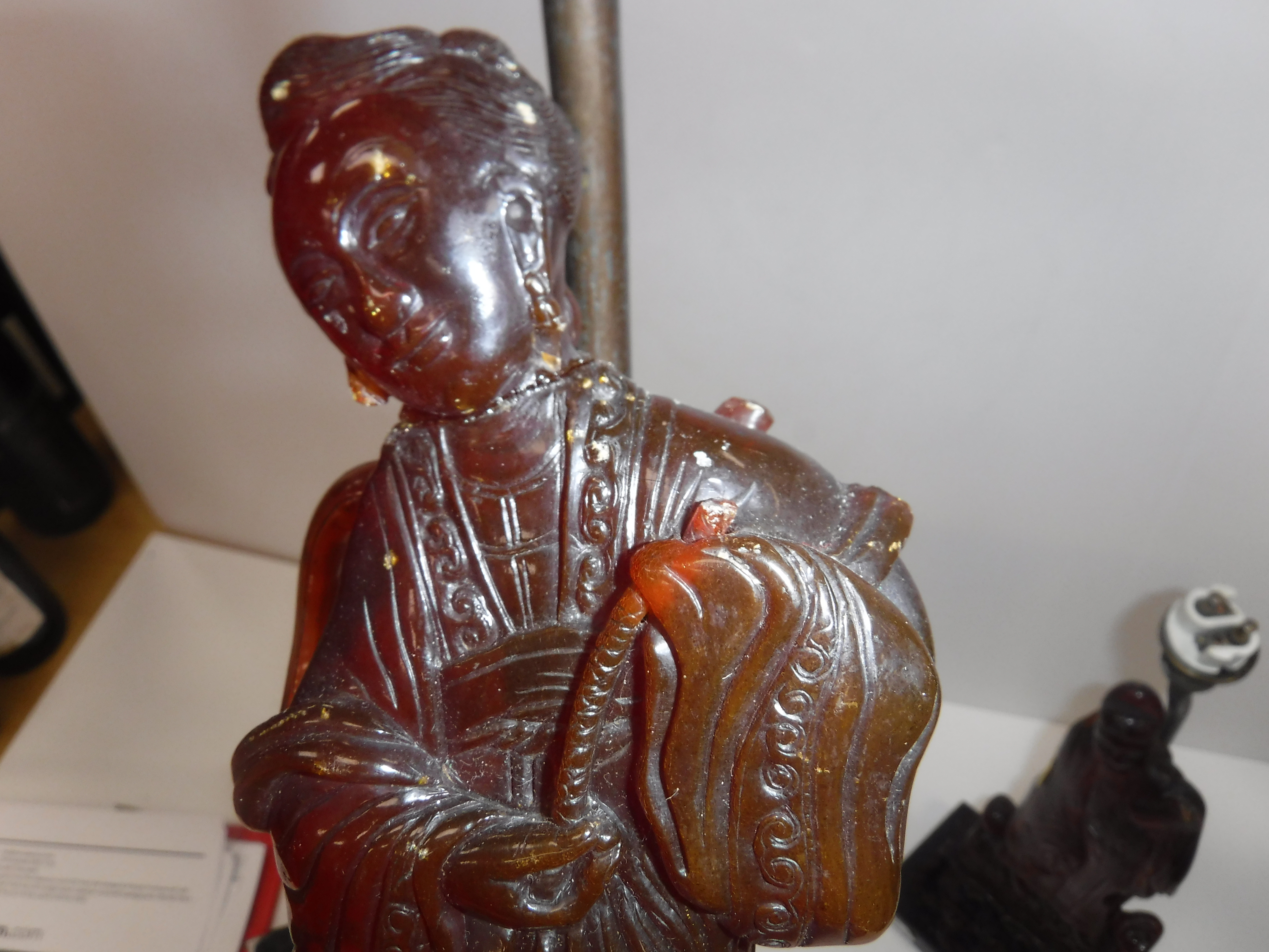 A pair of Chinese carved amber figures of a man and a woman in robes, - Image 18 of 27