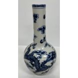A 19th Century Chinese blue and white vase of onion form decorated with four toed air dragons